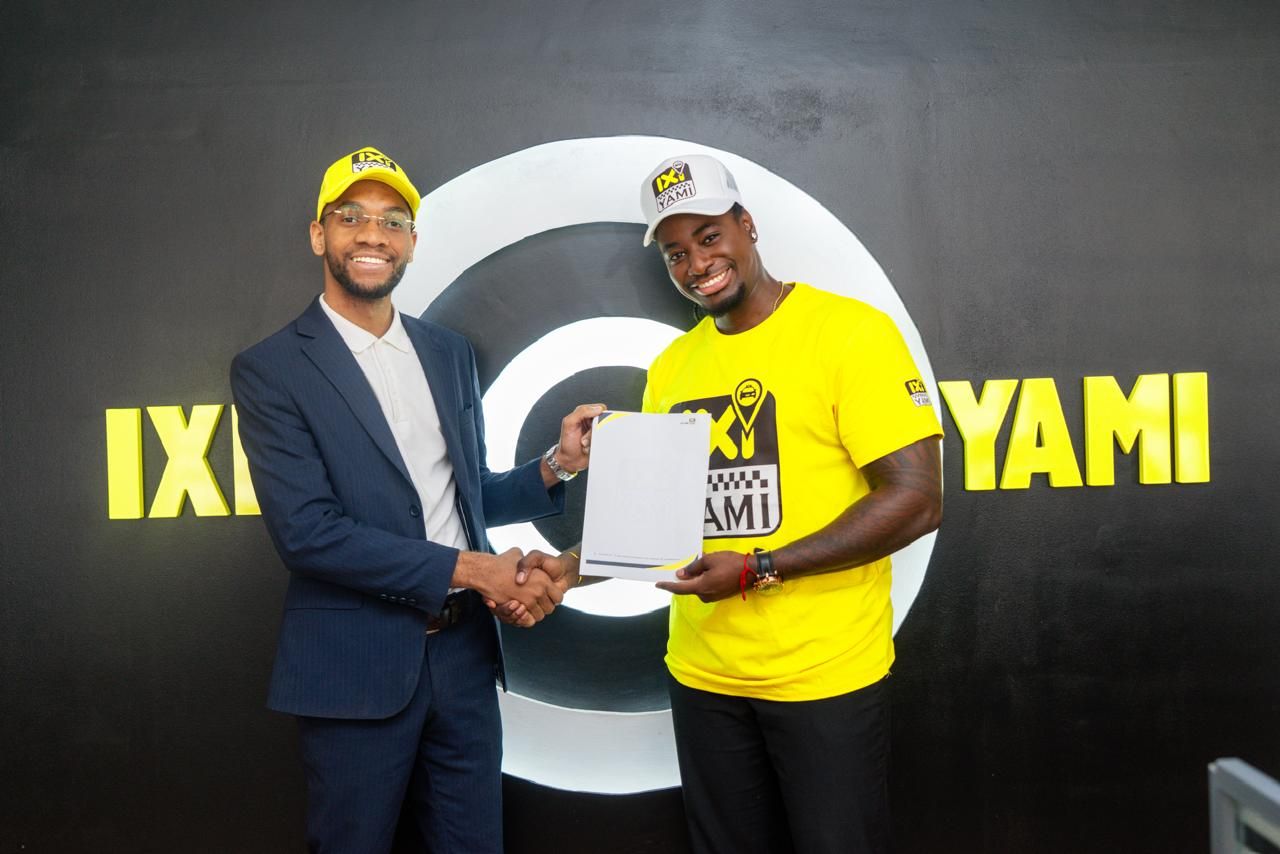 Handshake at an IXI YAMI partnership signing